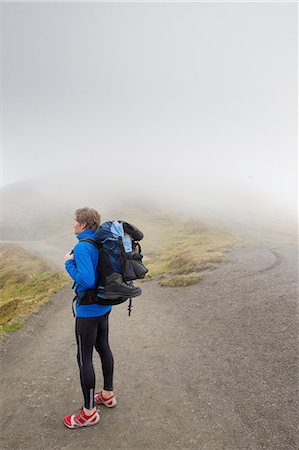 simsearch:649-08085723,k - Male hiker looking out over misty landscape, Grindelwald, Switzerland Foto de stock - Sin royalties Premium, Código: 649-08085702