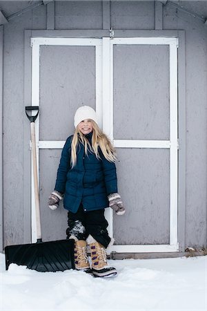 Girl grinning with excitement at snow Stock Photo - Premium Royalty-Free, Code: 649-08085908