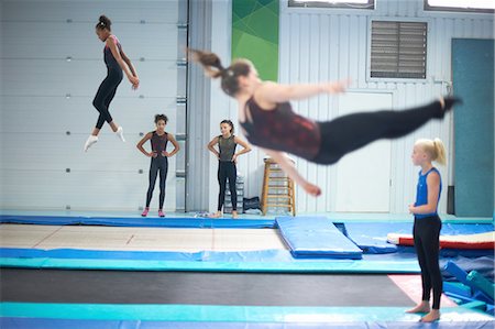 simsearch:640-06050736,k - Young gymnasts practising moves Stock Photo - Premium Royalty-Free, Code: 649-08085959