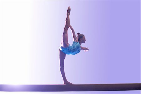 simsearch:6122-07700269,k - Young gymnast performing on balance beam Stock Photo - Premium Royalty-Free, Code: 649-08085968