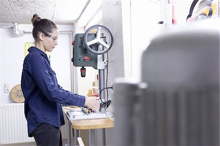simsearch:649-07710266,k - Young female carpenter drilling timber in workshop Stock Photo - Premium Royalty-Free, Code: 649-08086056