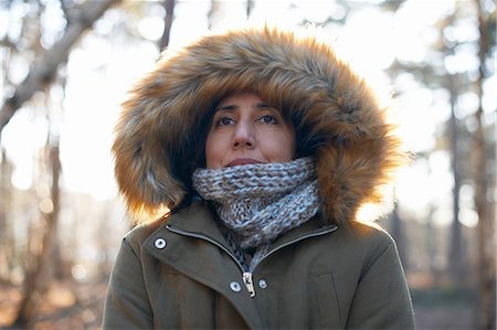 simsearch:649-08924209,k - Portrait of mature woman wearing fur hood and scarf in forest Stock Photo - Premium Royalty-Free, Code: 649-08086092