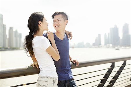 simsearch:649-07560084,k - Smiling tourist couple on bridge, The Bund, Shanghai, China Stock Photo - Premium Royalty-Free, Code: 649-08086327