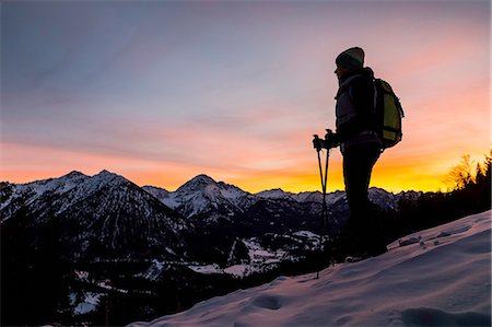 simsearch:649-08924209,k - Young female hiker looking out from mountainside at dusk, Reutte, Tyrol, Austria Stock Photo - Premium Royalty-Free, Code: 649-08086388