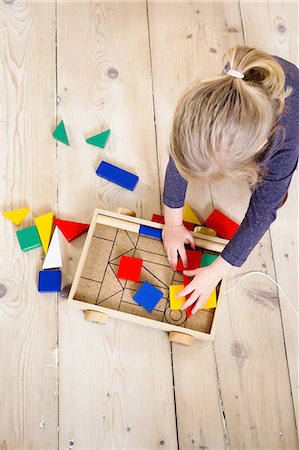 simsearch:649-06845253,k - Girl playing with building blocks at home Stock Photo - Premium Royalty-Free, Code: 649-08118187