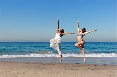 simsearch:649-07063753,k - Two young female dancers leaping mid air on beach Stock Photo - Premium Royalty-Free, Code: 649-08118894