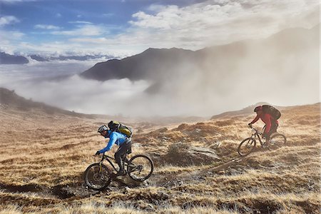 Mature men mountain biking, Valais, Switzerland Stock Photo - Premium Royalty-Free, Code: 649-08119077