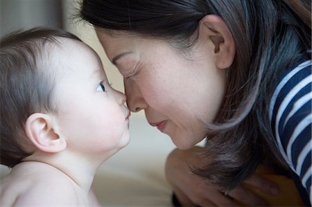 Mother and baby boy rubbing noses, close-up Stock Photo - Premium Royalty-Free, Code: 649-08119444