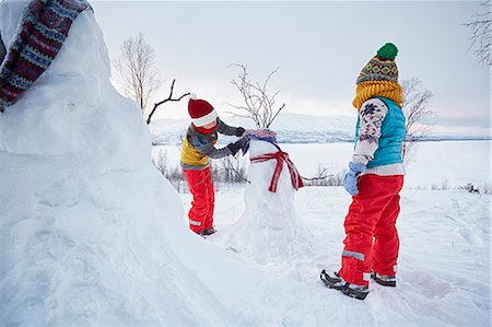 Two boys making snowmen , Hemavan,Sweden Stock Photo - Premium Royalty-Free, Code: 649-08125331