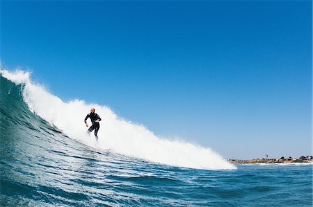 simsearch:649-08117852,k - Surfer riding waves in ocean, California, USA Foto de stock - Sin royalties Premium, Código: 649-08125518