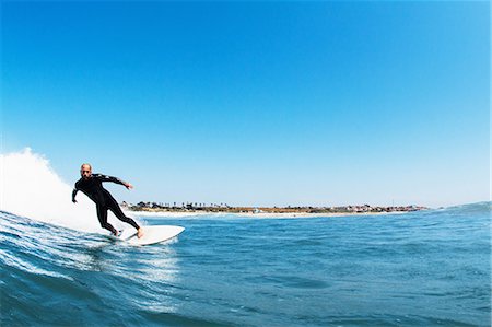 simsearch:649-08117852,k - Surfer riding waves in ocean, California, USA Foto de stock - Sin royalties Premium, Código: 649-08125519
