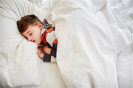 Young boy sleeping in bed Stock Photo - Premium Royalty-Free, Code: 649-08125781