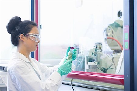 simsearch:649-08085222,k - Young female scientist  looking at sample in lab Stock Photo - Premium Royalty-Free, Code: 649-08126039
