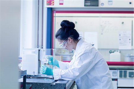 simsearch:649-08085222,k - Young female scientist in lab pipetting sample Stock Photo - Premium Royalty-Free, Code: 649-08126032