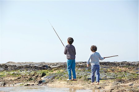 simsearch:649-07761212,k - Two young boys, fishing on beach, rear view Stock Photo - Premium Royalty-Free, Code: 649-08144192