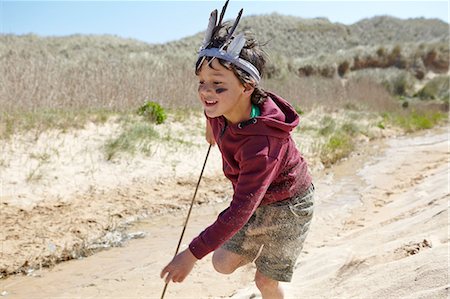 simsearch:649-07761212,k - Young boy, wearing fancy dress, running on sand Stock Photo - Premium Royalty-Free, Code: 649-08144217