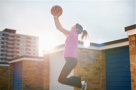 simsearch:649-07239531,k - Mature female basketball player catching ball mid air Stock Photo - Premium Royalty-Free, Code: 649-08144366