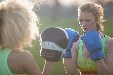 female boxing - Two women exercising with boxing gloves in the park Stock Photo - Premium Royalty-Free, Code: 649-08144710