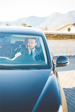 Young businessman sitting in car Stock Photo - Premium Royalty-Free, Code: 649-08180077