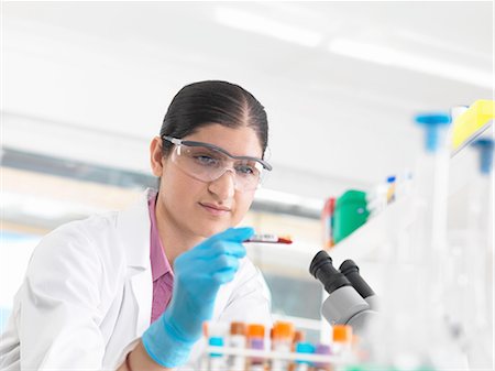 simsearch:649-07279799,k - Young woman scientist viewing blood tube during clinical testing of medical samples in a laboratory Stock Photo - Premium Royalty-Free, Code: 649-08180217