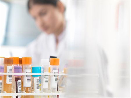 simsearch:649-07279799,k - Female doctor preparing blood and urine samples at desk Stock Photo - Premium Royalty-Free, Code: 649-08180345