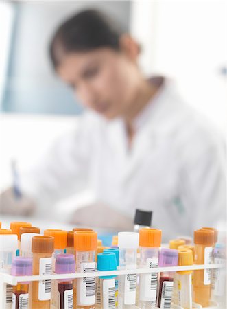 simsearch:649-07279799,k - Female doctor making notes on blood and urine samples at desk Stock Photo - Premium Royalty-Free, Code: 649-08180346
