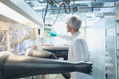 simsearch:649-08085222,k - Male scientist adjusting switch for fume hood in lab cleanroom Stock Photo - Premium Royalty-Free, Code: 649-08180592