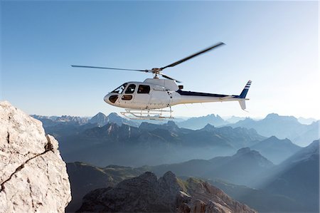 Helicopter transporting BASE jumpers to summit, Dolomites, Italy Stock Photo - Premium Royalty-Free, Code: 649-08180690