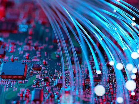 simsearch:649-07279549,k - Fibre optics flowing through circuit boards from a laptop computer, close-up Stock Photo - Premium Royalty-Free, Code: 649-08237903