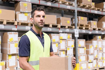 simsearch:649-07239373,k - Male warehouse worker preparing order in distribution warehouse Stock Photo - Premium Royalty-Free, Code: 649-08237949