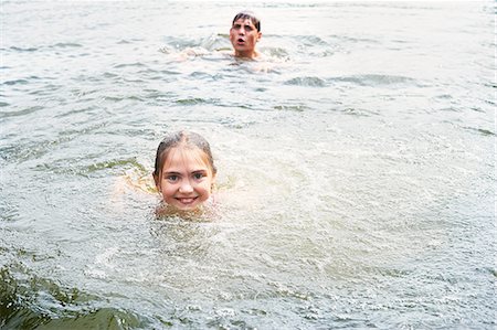 simsearch:614-08270379,k - Teenage boy and sister swimming in rural lake Stock Photo - Premium Royalty-Free, Code: 649-08238766