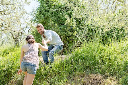 simsearch:649-08239088,k - Low angle view of young man helping young woman up hill Stock Photo - Premium Royalty-Free, Code: 649-08239093
