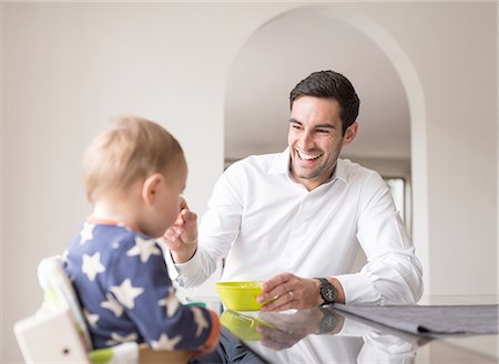 simsearch:649-07437107,k - Father feeding young son, indoors Stock Photo - Premium Royalty-Free, Code: 649-08232497