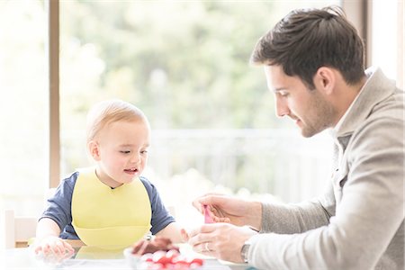 simsearch:649-07437107,k - Father feeding young son, indoors Stock Photo - Premium Royalty-Free, Code: 649-08232502