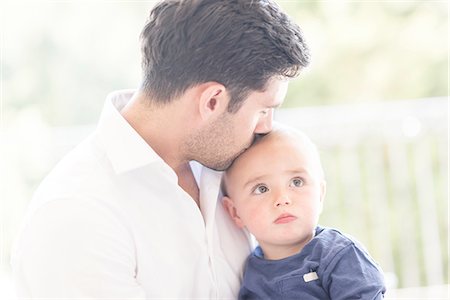 simsearch:649-07437107,k - Father kissing young son on head Stock Photo - Premium Royalty-Free, Code: 649-08232503