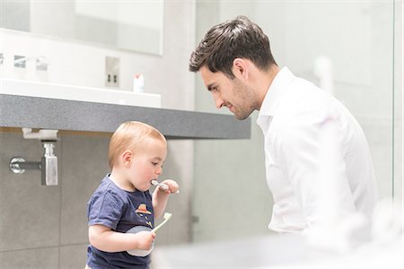simsearch:649-07437107,k - Father watching young brush teeth Stock Photo - Premium Royalty-Free, Code: 649-08232516