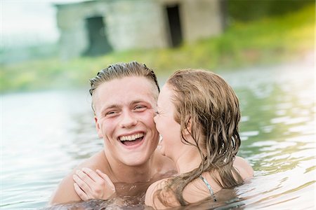 Young couple laughing in Secret Lagoon hot spring (Gamla Laugin), Fludir, Iceland Stock Photo - Premium Royalty-Free, Code: 649-08232740