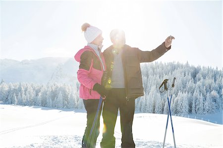 simsearch:649-07438003,k - Senior couple on snowy landscape using smartphone to take photograph, Sattelbergalm, Tyrol, Austria Stock Photo - Premium Royalty-Free, Code: 649-08306441