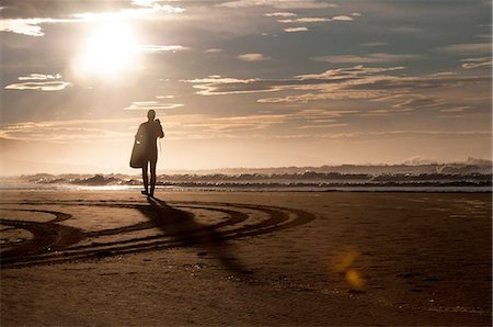 simsearch:614-06814364,k - Silhouette of diver on sand, Wild Coast, South Africa Stock Photo - Premium Royalty-Free, Code: 649-08306832