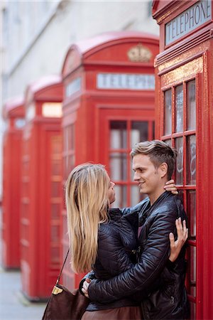red call box - Romantic young couple hugging next to red phone boxes, London, England, UK Stock Photo - Premium Royalty-Free, Code: 649-08328067