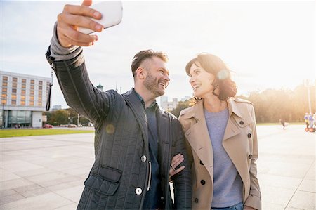 Mid adult couple taking selfie on phone Stock Photo - Premium Royalty-Free, Code: 649-08328604
