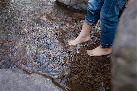 simsearch:649-07761212,k - Legs and bare feet of female toddler dangling over rockpool Stock Photo - Premium Royalty-Free, Code: 649-08328707
