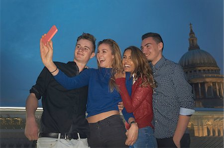 simsearch:6113-07542497,k - Two young couples taking smartphone selfie in front of St Pauls at night, London, UK Stock Photo - Premium Royalty-Free, Code: 649-08328955