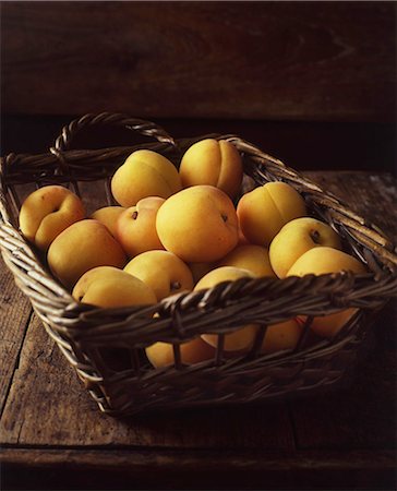 simsearch:614-01088098,k - Wicker basket of yellow peaches Stock Photo - Premium Royalty-Free, Code: 649-08423055