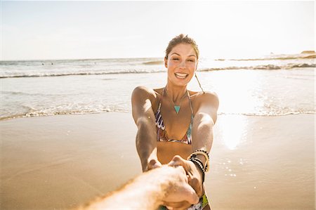 simsearch:649-07585546,k - Mid adult woman wearing bikini holding boyfriends hand on beach, Cape Town, South Africa Stock Photo - Premium Royalty-Free, Code: 649-08544015