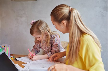 pony tail - Mother teaching daughter to write at desk Stock Photo - Premium Royalty-Free, Code: 649-08544052