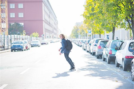 simsearch:649-07710443,k - Young male urban skateboarder swerve skateboarding on road Stock Photo - Premium Royalty-Free, Code: 649-08548888