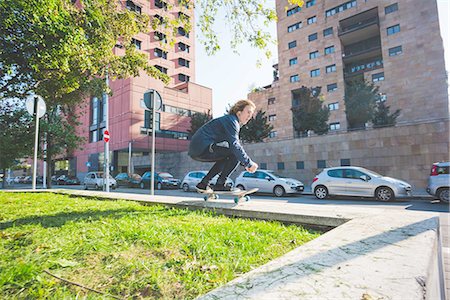 simsearch:649-07710443,k - Young male skateboarder skateboarding on urban wall Stock Photo - Premium Royalty-Free, Code: 649-08548898