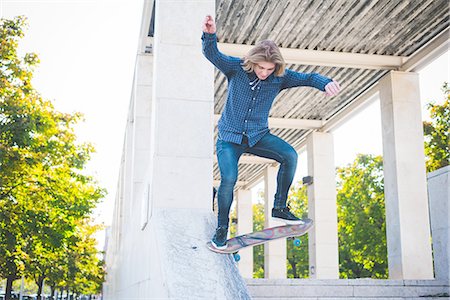 simsearch:649-07710443,k - Young male urban skateboarder skating down concrete structure Stock Photo - Premium Royalty-Free, Code: 649-08548893