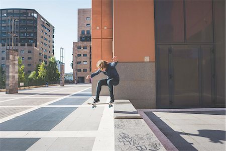 simsearch:649-07710443,k - Young male skateboarder skateboarding up urban step Stock Photo - Premium Royalty-Free, Code: 649-08548901